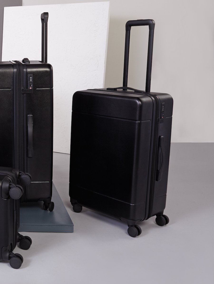 medium 26 inch hardshell stylish minimalist CALPAK Hue suitcase in black color; LHU1024-BLACK