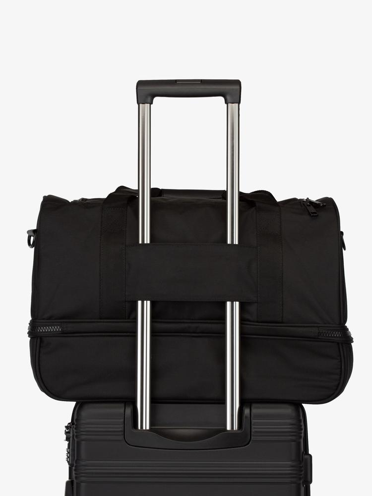 black CALPAK Stevyn duffel bag with luggage trolley sleeve; DST7019-BLACK