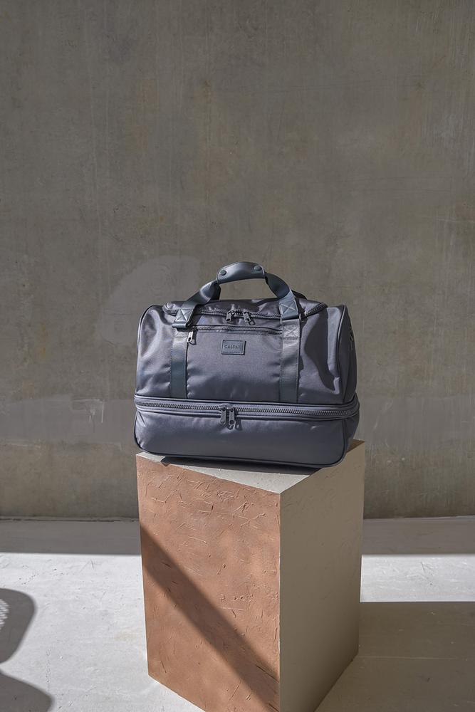 CALPAK Stevyn duffle bag with shoe compartment in grey color; DST7019-SLATE